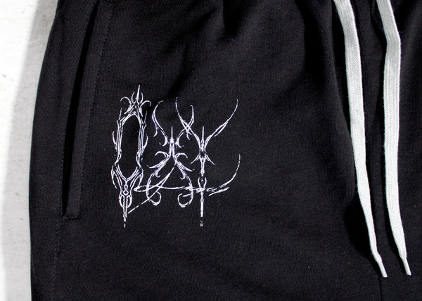 Black hoodie with white embroidered design on a white background
