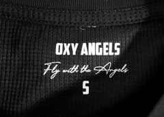 Black fabric with 'OXY ANGELS' and 'Fly with the Angels' text on a label.