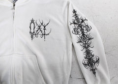 White hoodie with black floral designs on a light gray background