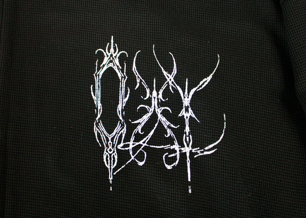 White abstract design on a black textured background