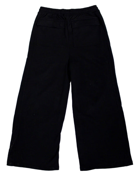 Black pants on a light gray textured background