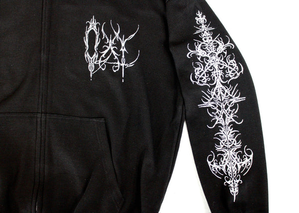 Black hoodie with white intricate designs on the back and sleeve against a white background