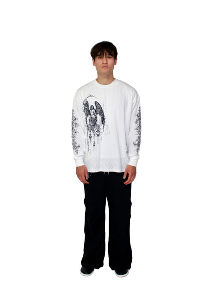 Person wearing a white graphic sweatshirt and black pants on a plain background