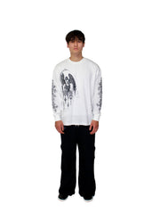 Person wearing a white graphic sweatshirt and black pants on a plain background